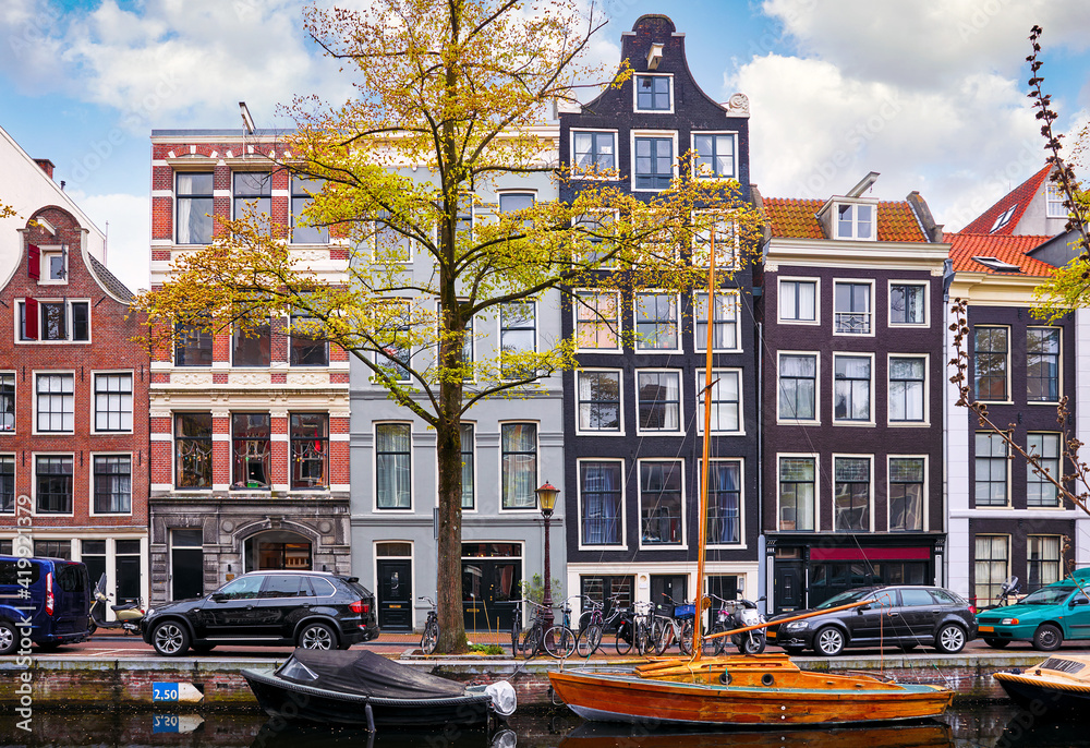 Channel in Amsterdam Netherlands houses river Amstel landmark old european city spring landscape.