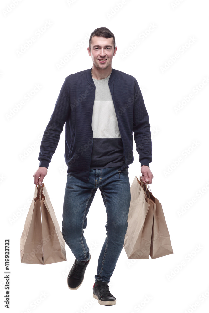 young man with shopping bags striding forward young man with shopping bags striding forward