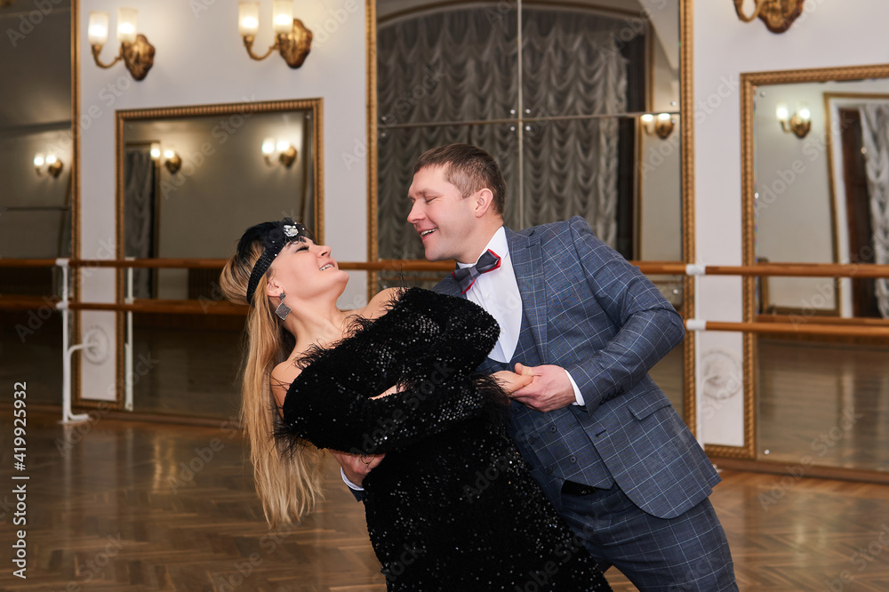man and woman amateur dancers laugh during classical dance with each other man and woman amateur dancers laugh during classical dance with each other