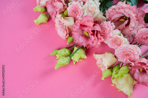 pink eustoma on pink surface © Diana Taliun