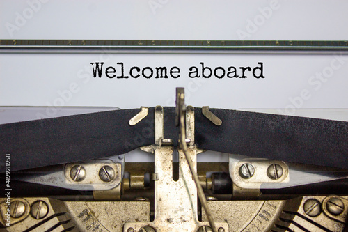 Welcome aboard symbol. Words welcome aboard typed on retro typewriter. Business and welcome aboard concept. Beautiful white background, copy space.