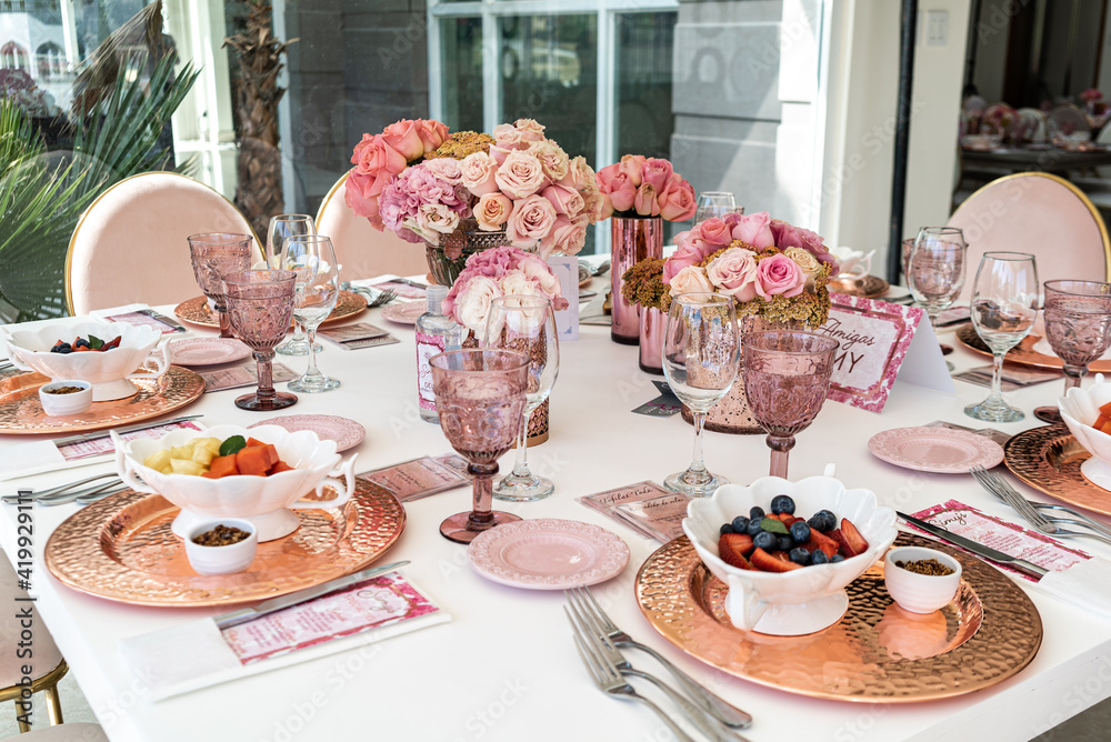Indoor pre wedding breakfast with beautiful pink and white tones