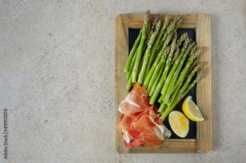 fresh green asparagus and jamon serrano photo