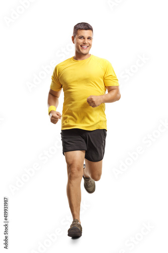 Young man in sportswear running towards camera