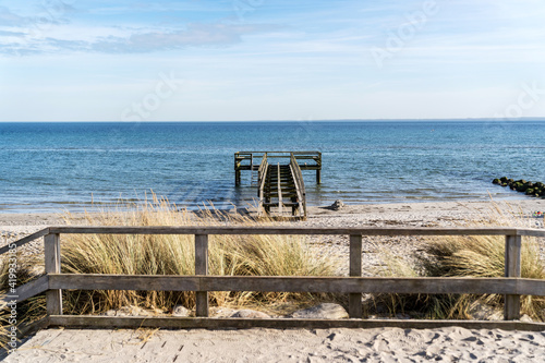 Fototapeta Naklejka Na Ścianę i Meble -  pier on the baltic sea on a sandy beach