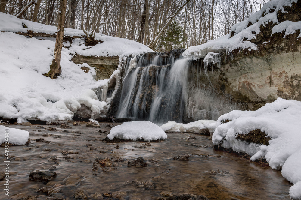 Dauda waterfall in winter .Small waterfall in Gauja national park. Dauda waterfall in winter .Small waterfall in Gauja national park.