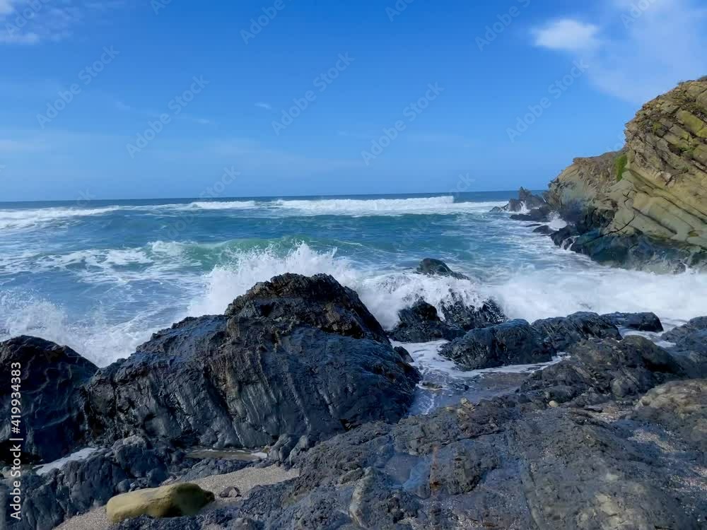 Waves crashing into rocks in northern California in Sonoma Coast Waves crashing into rocks in northern California in Sonoma Coast