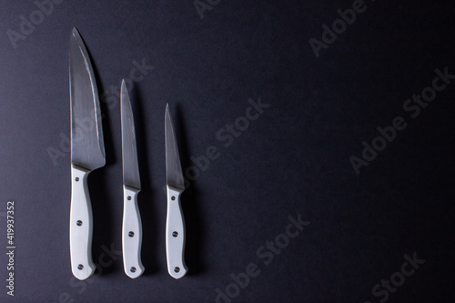 knife and fork on black