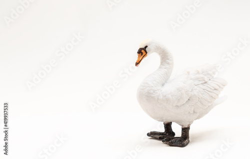 Realistic plastic toy swan white. Cute little swan toy for kids. Isolate. Copy space