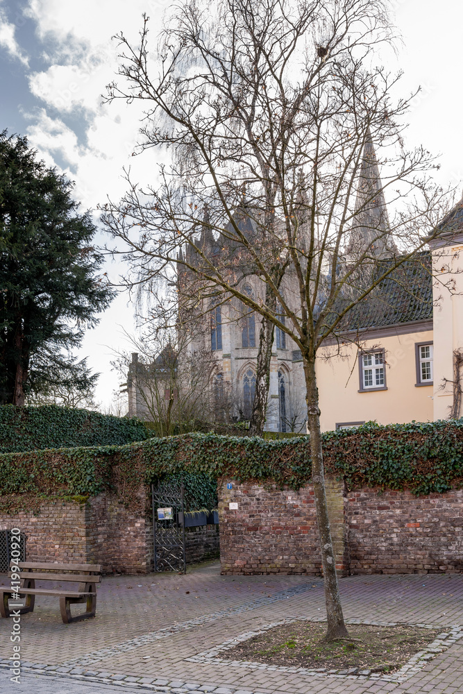 view of the church and part of the city wall in the old town of Xanten in Germany