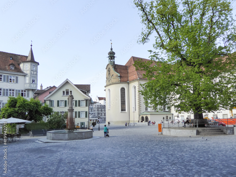 Obraz premium St. Gallen, Switzerland - May 21st 2017: Urban place in front of Stiftskirche