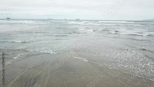 aerial shot of the coming tide at an estuary entrance