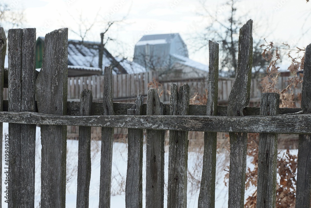 gray broken wooden plank wall fence a rural street gray broken wooden plank wall fence a rural street