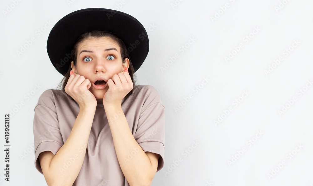 Amazed woman looking at camera isolated on a white background