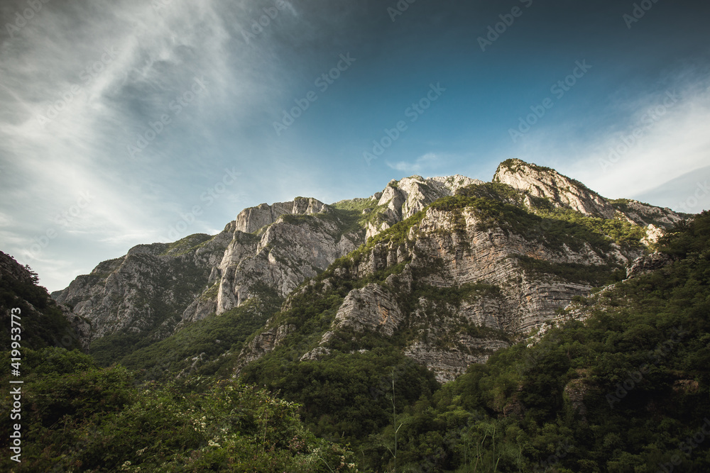 Obraz premium Mysty clouds over the mountain peaks