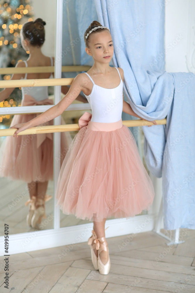 Fototapeta premium Ballet. A little ballerina at a rehearsal.
