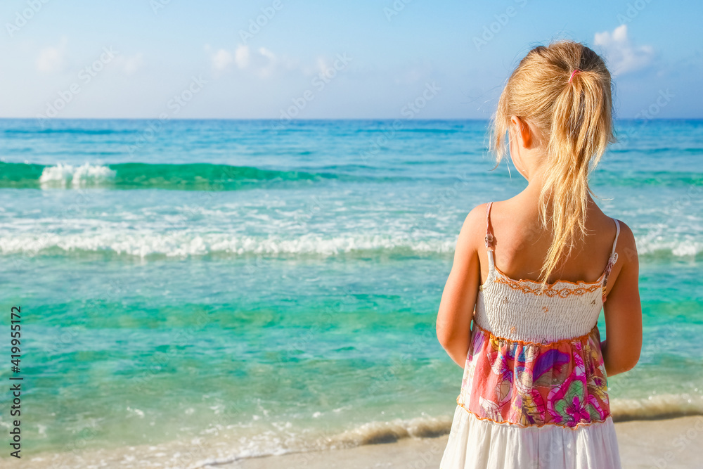 happy child playing by the sea outdoors happy child playing by the sea outdoors