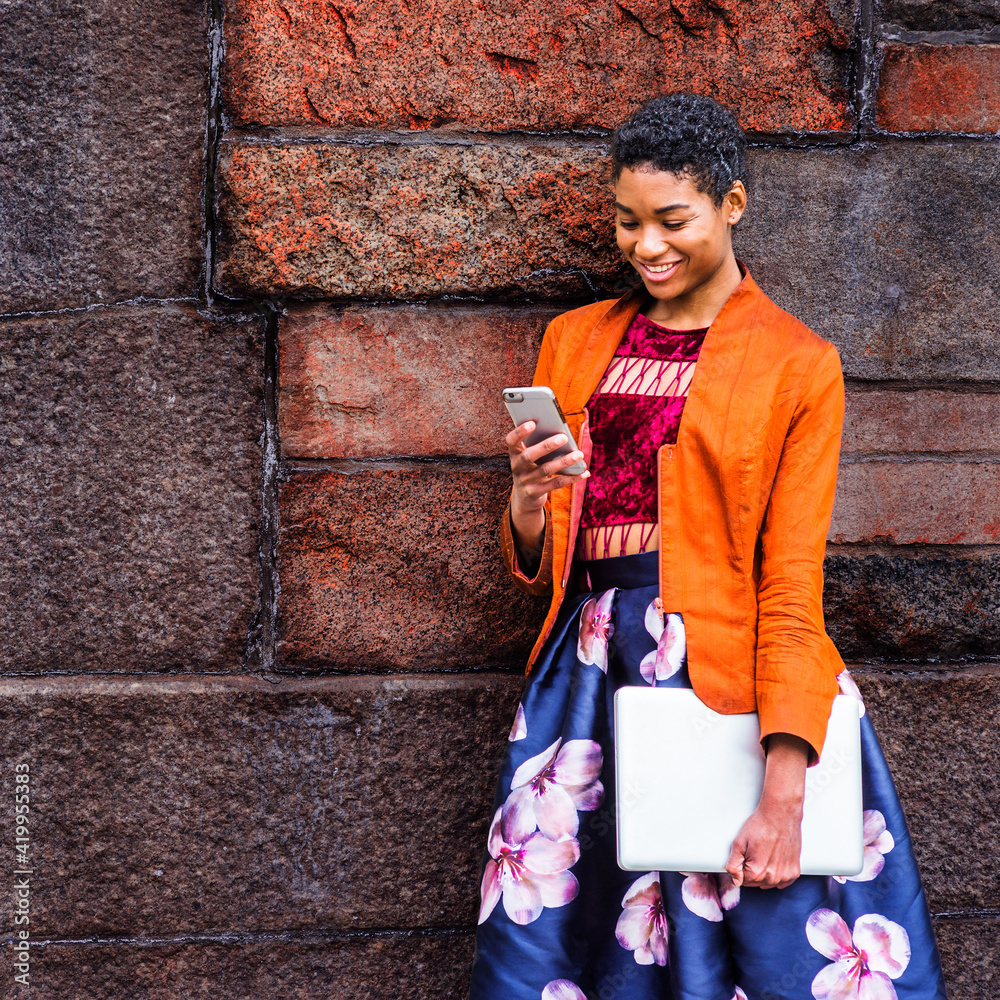 Happy Modern Black Young College Girl Reading, Texting Outside
