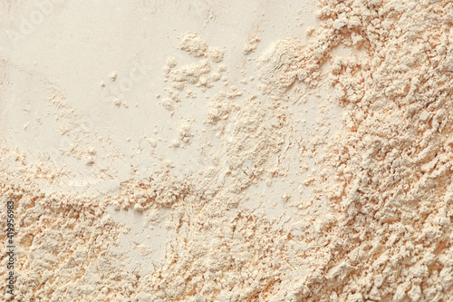 Vanilla toned facial powder for decorative cosmetics background