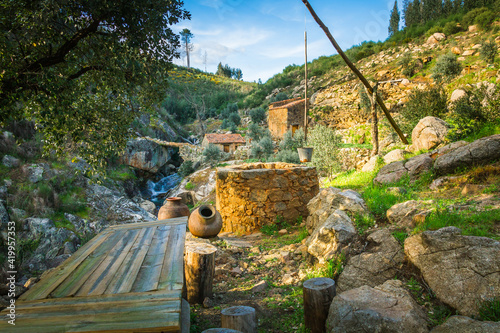 Ancient stone water well in the stone houses village of Queixoperra - Mouriscas - Portugal.  photo