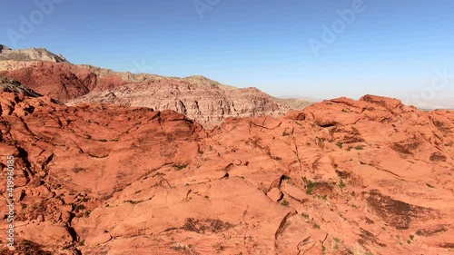Untitled Project4K Aerial drone shot of a set of large red rock formations in the The Red Rock Canyon National Conservation Area in Clark County, Nevada