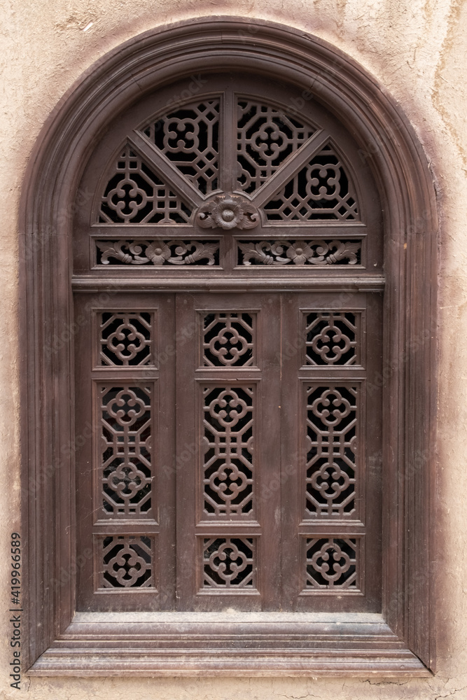 asia style architecture arched wooden carving window texture on imin minaret