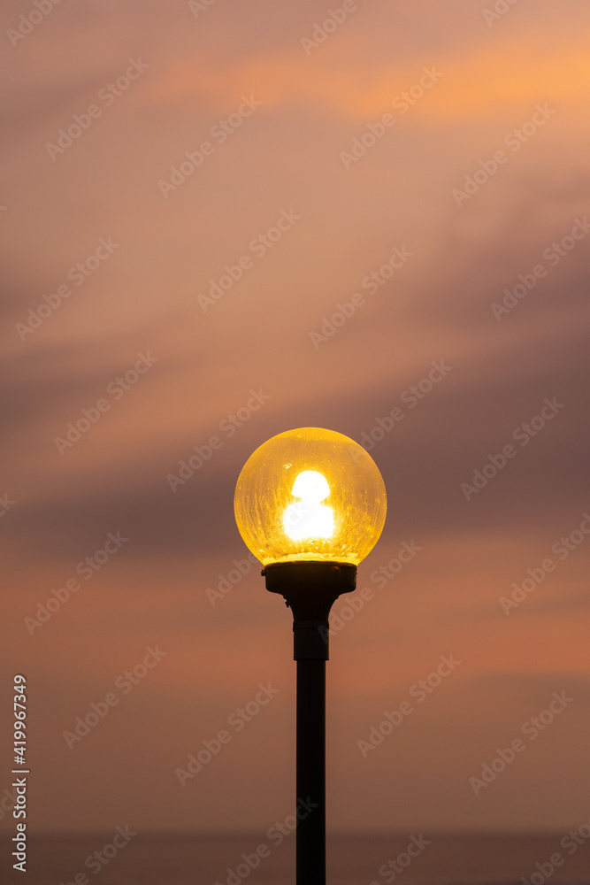 street lamp in the sunset.