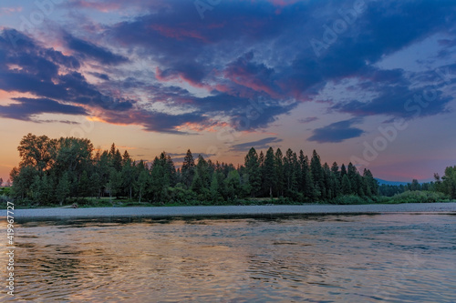Sunset clouds over the Flathead River in Columbia Falls, Montana, USA © Danita Delimont