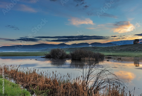 Wetlands pond near Melrose  Montana  USA