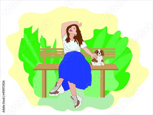 Happy smiling woman sits on a Park bench with her dog and caressing it.