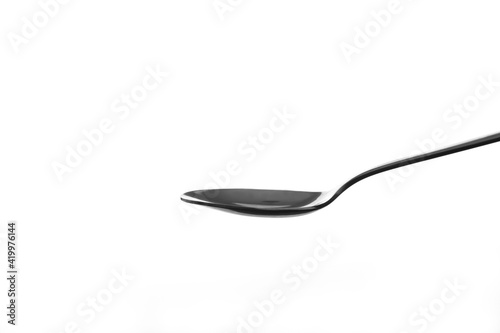 Metal spoon on white background.