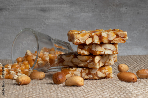 Typical Brazilian sweet known as pé de moleque and popcorn grains. photo