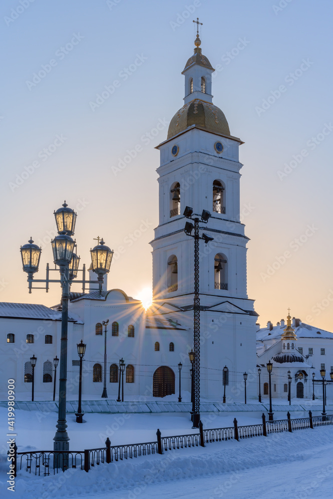 The ancient bell tower of the St. Sophia Cathedral of the Tobolsk Kremlin (Russia) in the morning sun on a frosty winter day. Delicate pastel colors serve as a great backdrop for a stately structure