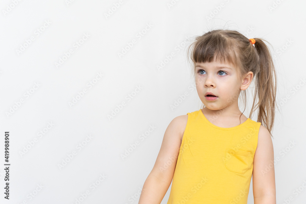 portrait of surprised little girl with copy space