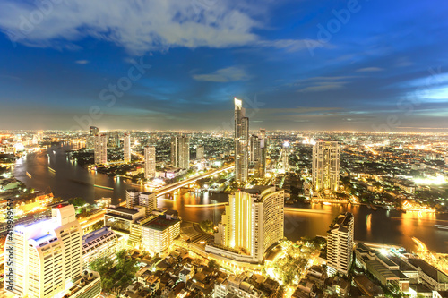 Bangkok Transportation at Dusk with Modern Business Building along the river (Thailand)