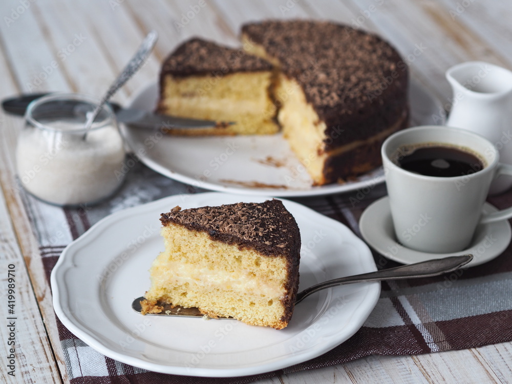 Freshly baked sponge cake Enchantress, covered with icing with grated chocolate. Freshly baked sponge cake Enchantress, covered with icing with grated chocolate.