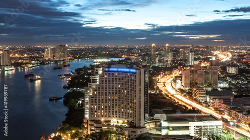 Bangkok Transportation at Dusk with Modern Business Building along the river  Thailand 