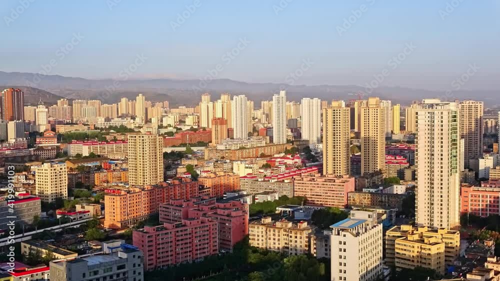 Cityscape at sunrise, shadow moving across buildings, time lapse Cityscape at sunrise, shadow moving across buildings, time lapse