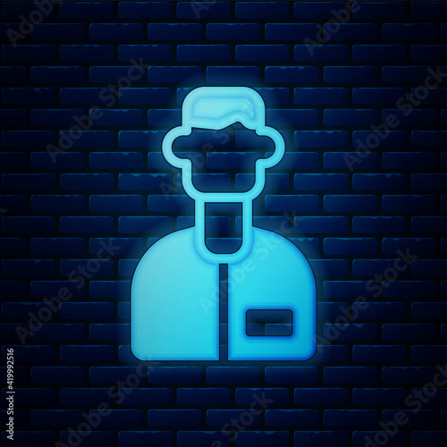 Glowing neon Laboratory assistant icon isolated on brick wall background. Vector