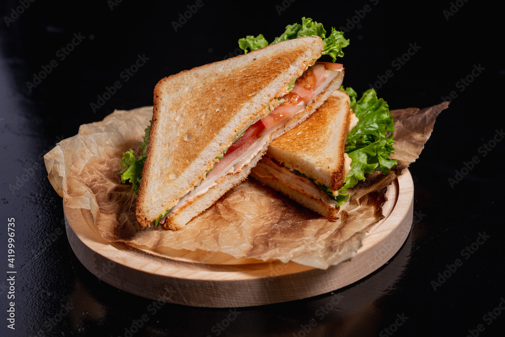 Breakfast sandwich on a black background