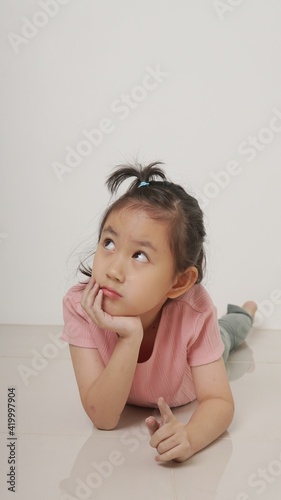 Cute little girl thinking about something