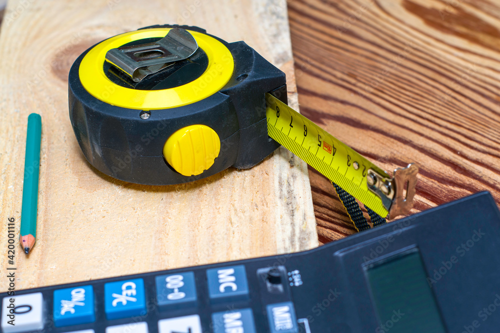construction metertape measure calculator for calculations pencil and