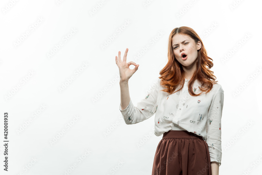 pretty woman with red hair in suit gesturing with hands studio pretty woman with red hair in suit gesturing with hands studio