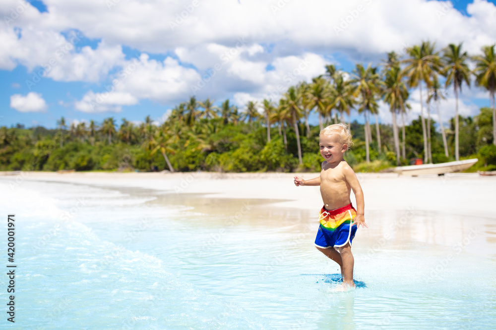 Kids play on tropical beach. Sand and water toy. Kids play on tropical beach. Sand and water toy.
