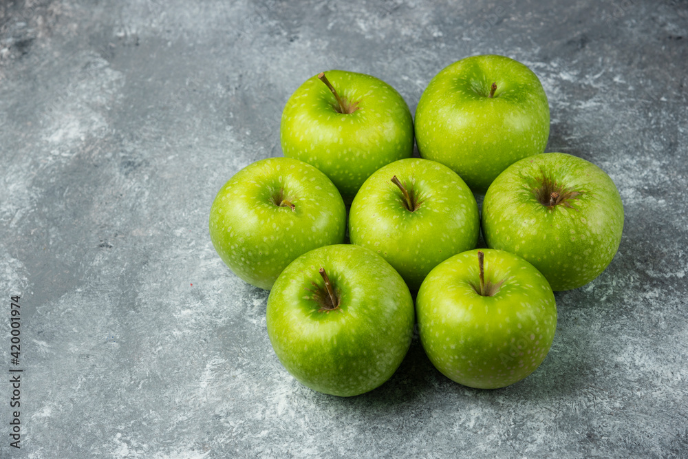 A lot of ripe apples on marble background A lot of ripe apples on marble background