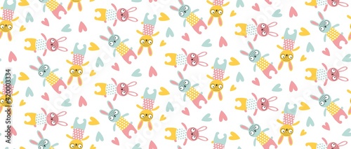 Vector seamless pattern with sewn bunnie, rabbit, heart in children's pastel colors. For printing on fabric, paper, nursery wallpaper, as background. Easter, baby fabric. Pink, yellow, blue. Isolated