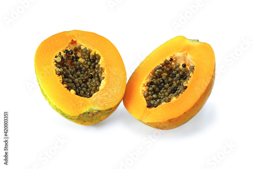 Two halfs papaya with black grains isolated on white