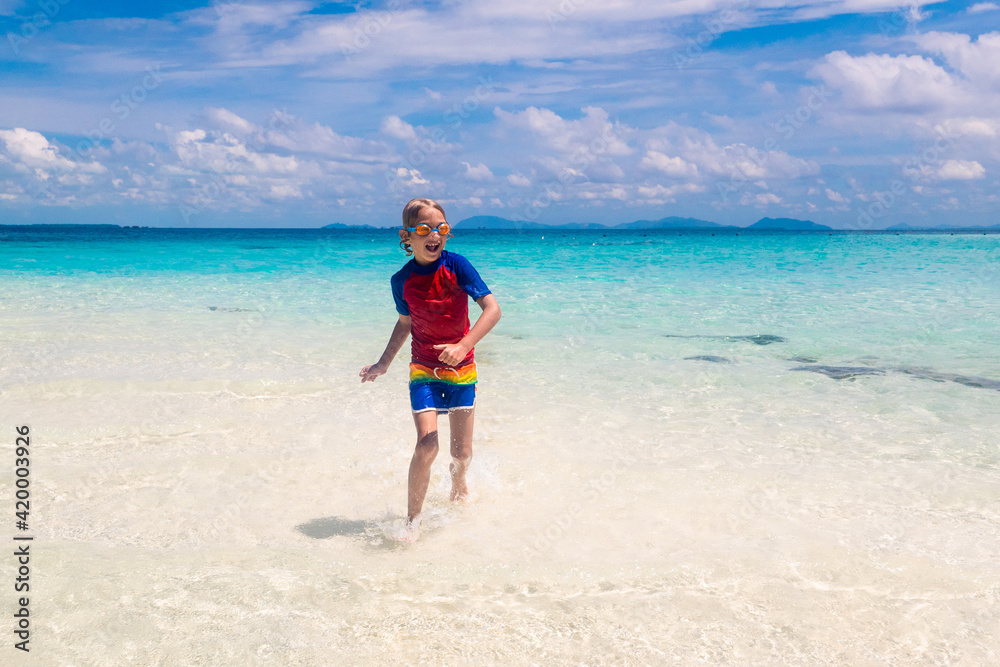 Kids playing on beach. Children play at sea.