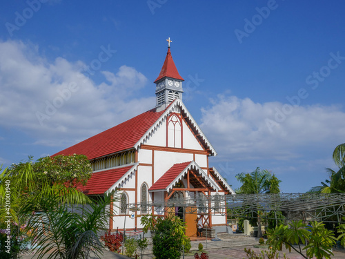 Landscape view of ancient colonial era catholic church in Sikka village, East Flores island, East Nusa Tenggara, Indonesia photo