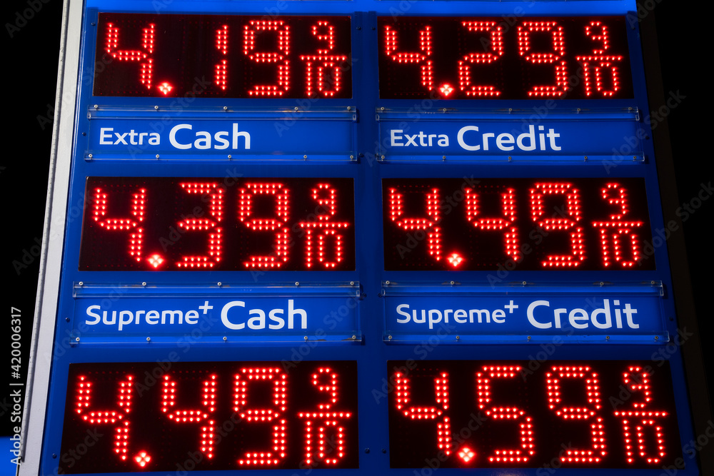Close up on a illuminated gas station price sign